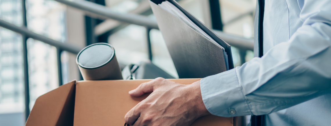 Employee resigning with documents and belongings